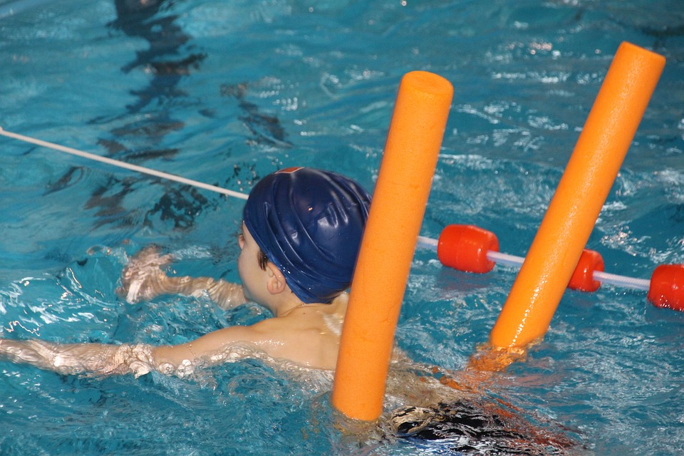 Boy having a swimming lessons