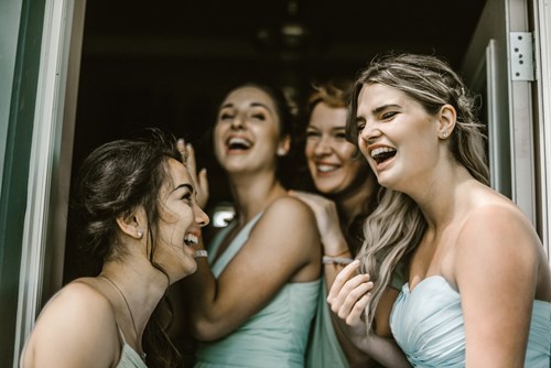 Bridesmaids laughing