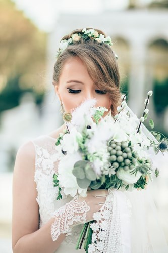 Bride smelling flowers