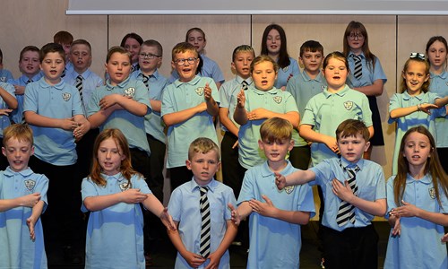 pupils singing at opening of school