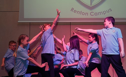 pupils dancing at opening of school