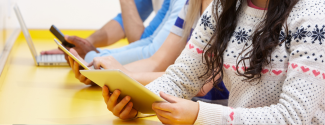 3 people using laptops and tablets