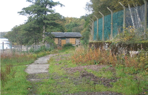 Boat House Before - boarded up and run down