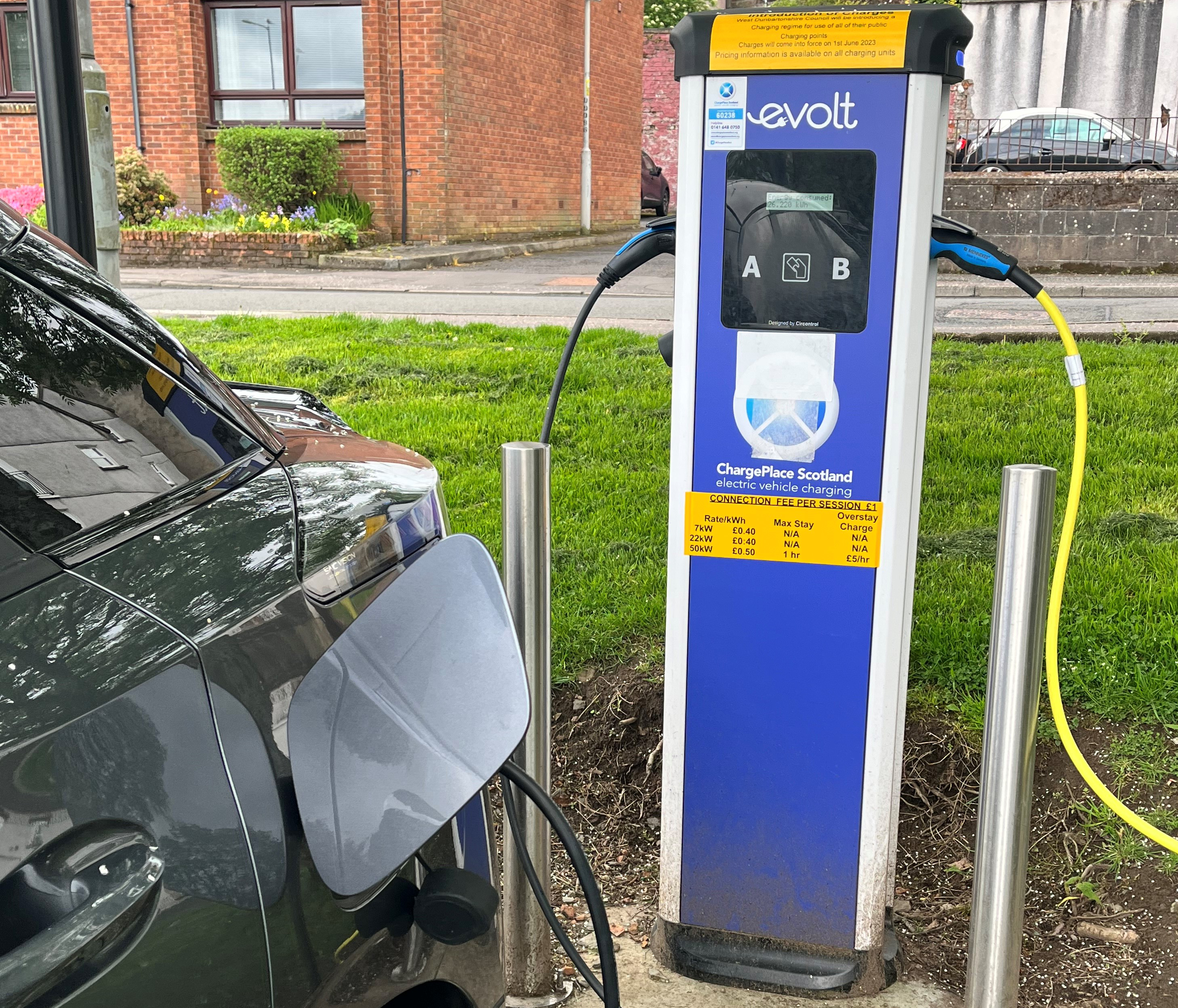 Black car on evolt EV charging 